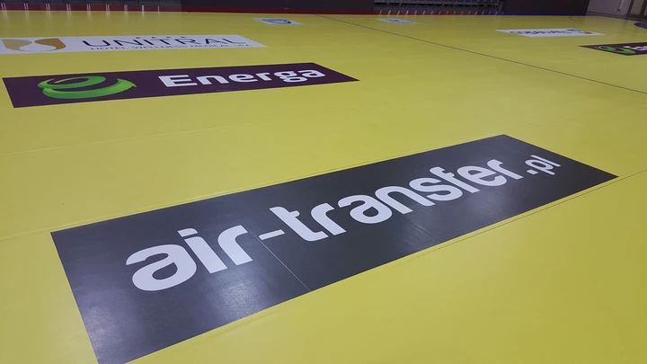 Logo na parkiecie - Air Transfer